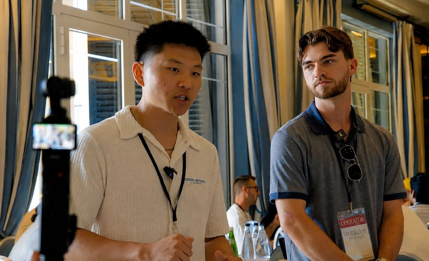 Nate Herk speaking with another attendee at Workless AI in Montenegro